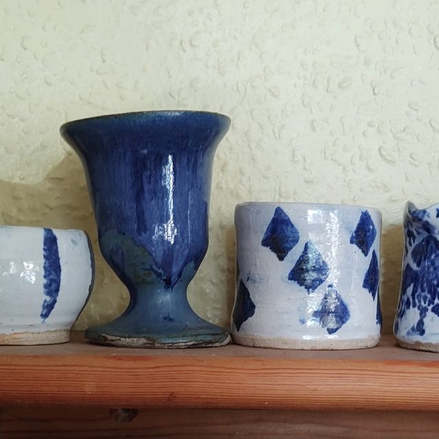 Wobbly pots on a shelf