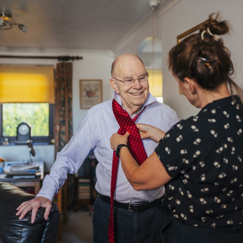 Woman caring for older man