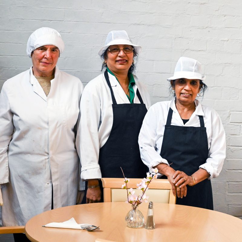 3 women, in uniform, at work