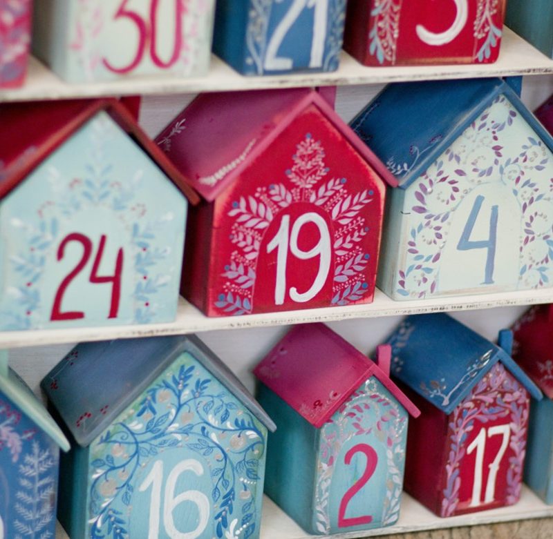 Little 3d houses on shelves, with numbers on them