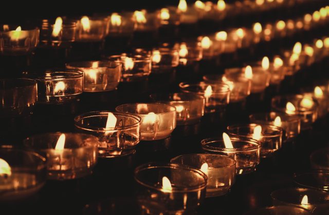 Rows of lit candles