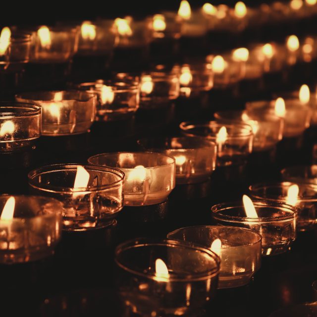 Rows of lit candles