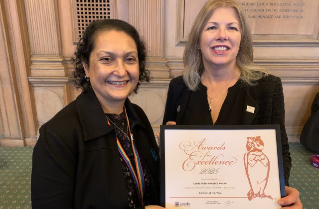 Jo Volpe, CEO for Leeds Older People's Forum (LOPF) accepts the LOPF Partner of the Year Award from Caroline Baria, Director of Adults & Health.