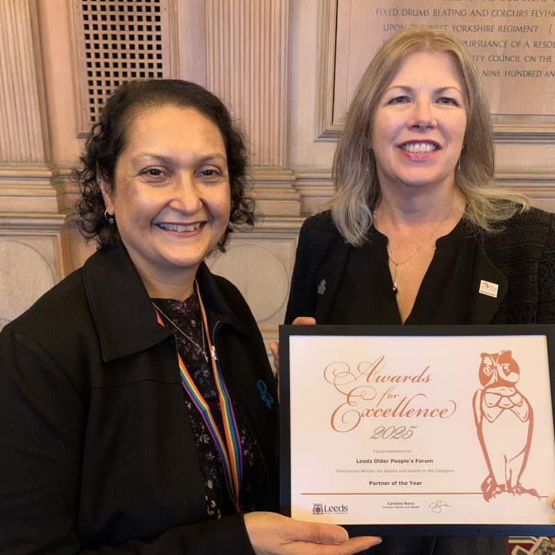 Jo Volpe, CEO for Leeds Older People's Forum (LOPF) accepts the LOPF Partner of the Year Award from Caroline Baria, Director of Adults & Health.