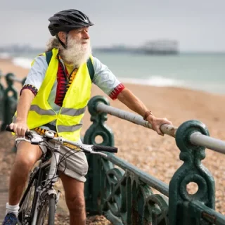 Man on bike near the coast